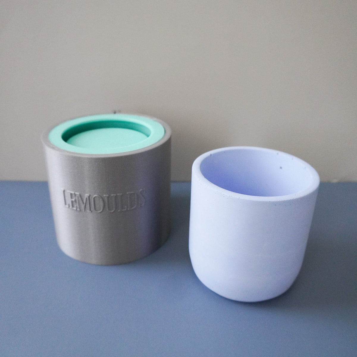 silicone pot mould with outside support ring and blue concrete pot