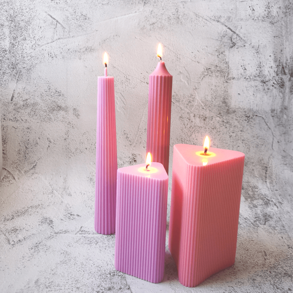 group of lighted pillar candles